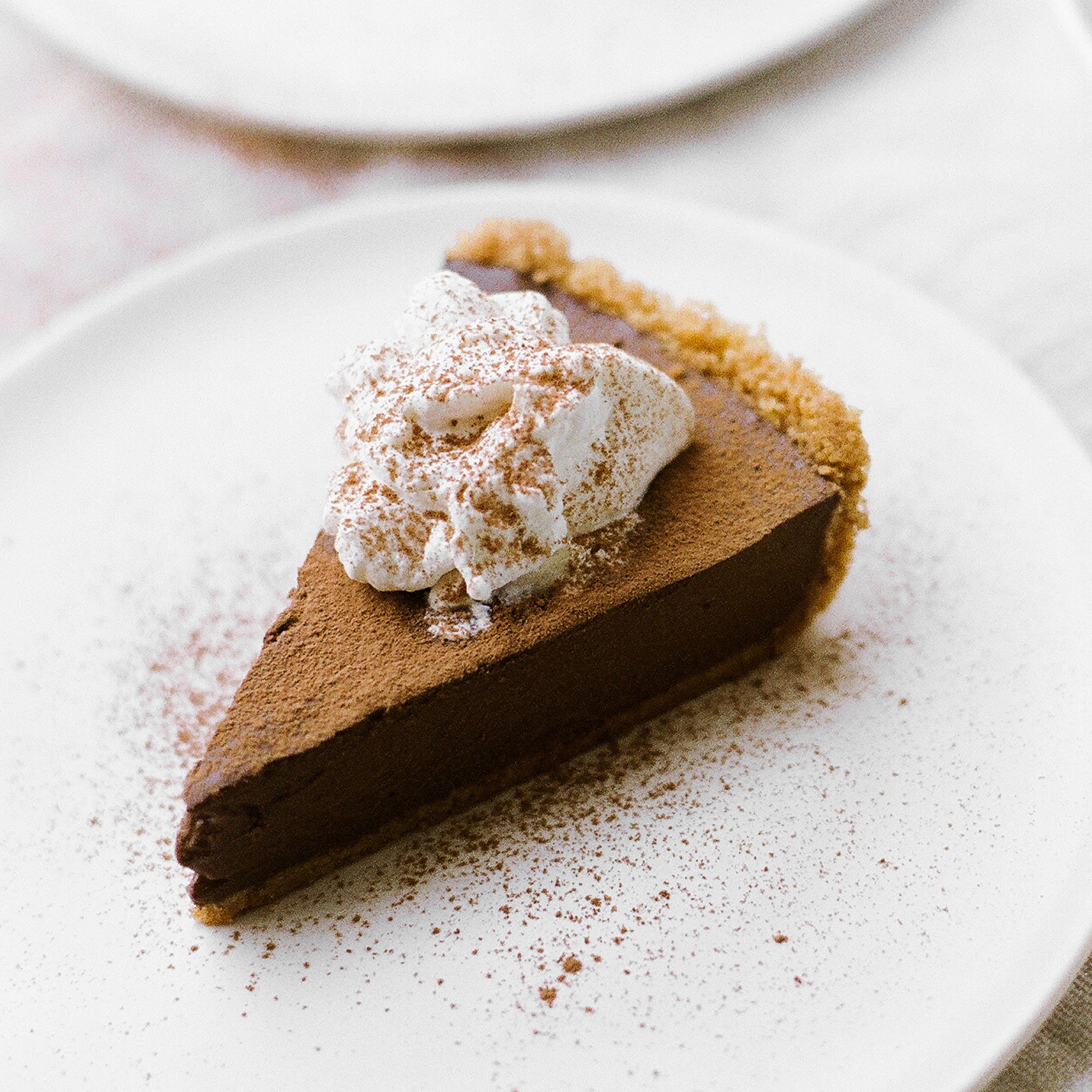 One of my all-time favorites, this Chocolate Pudding Pie features a graham cracker crust, rich double chocolate pudding filling, and whipped cream on top!