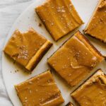 Dulce de Leche Cheesecake Bars are the perfect rich and creamy salty-sweet treat that's easy to make and transport. Such a crowd pleaser!