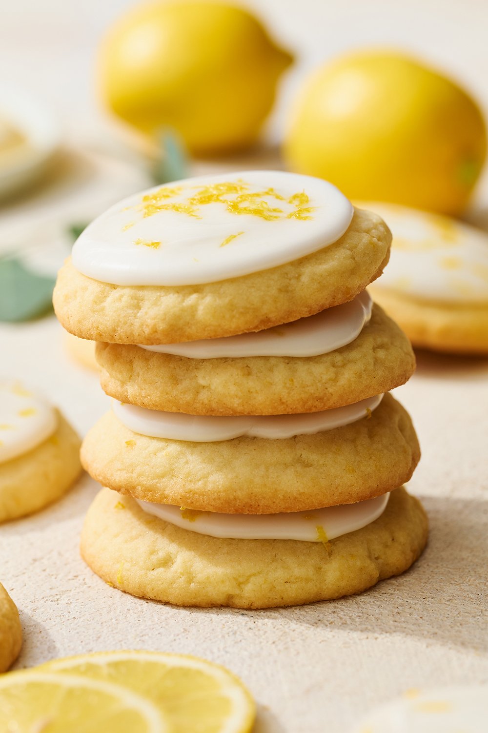 stack of homemade lemon cookies with glaze on top