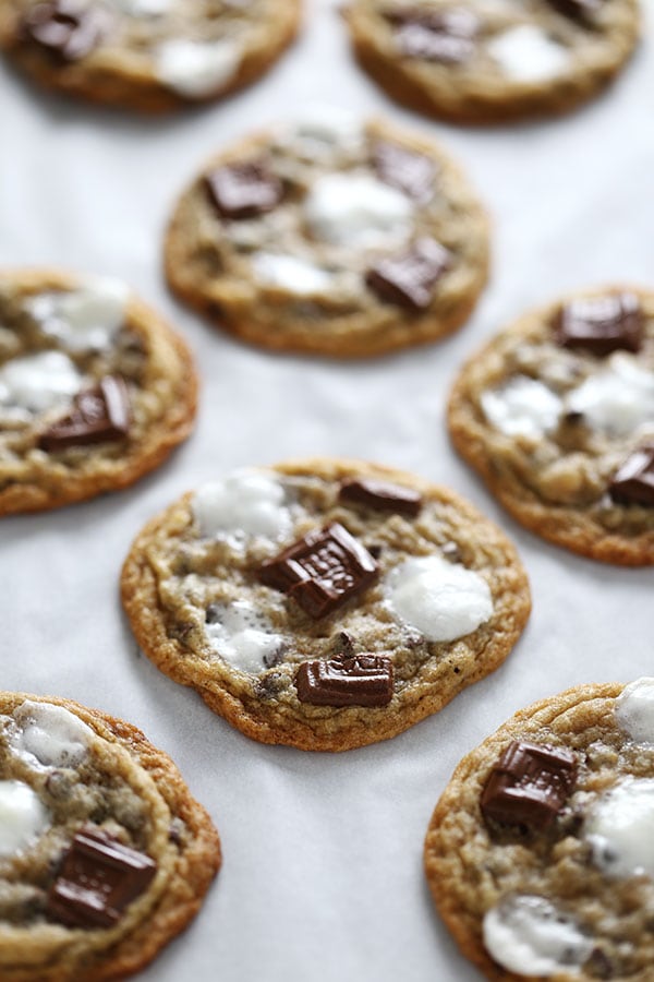 several freshly-baked s'mores cookies on parchment paper