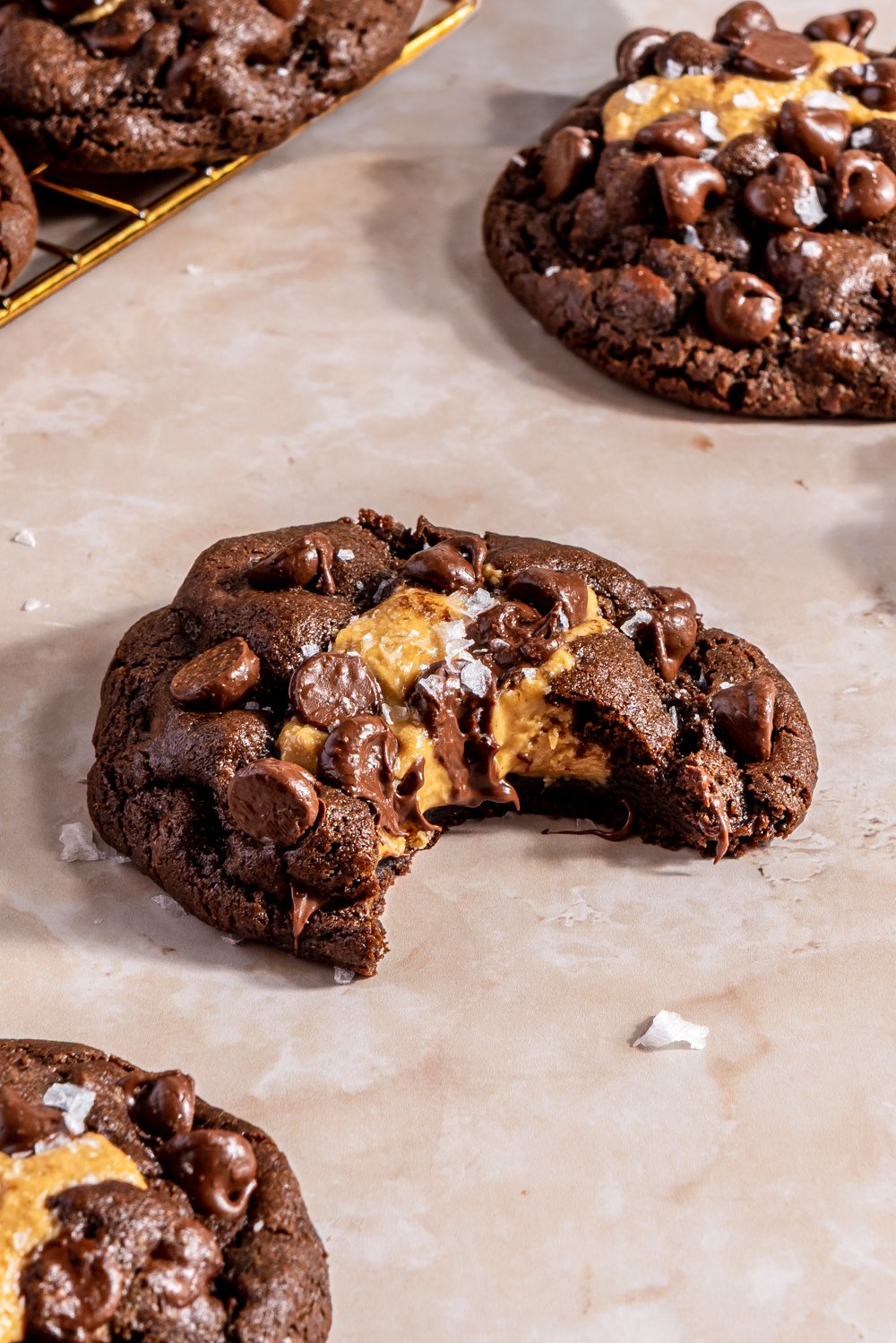 bite of peanut butter stuffed chocolate cookie to show interior soft and fudgy texture