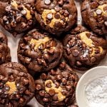 platter of peanut butter stuffed chocolate cookies with a pinch bowl of flaky sea salt