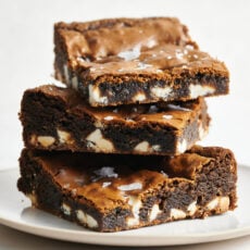 stack of easy homemade gingerbread blondies with white chocolate chips studded throughout