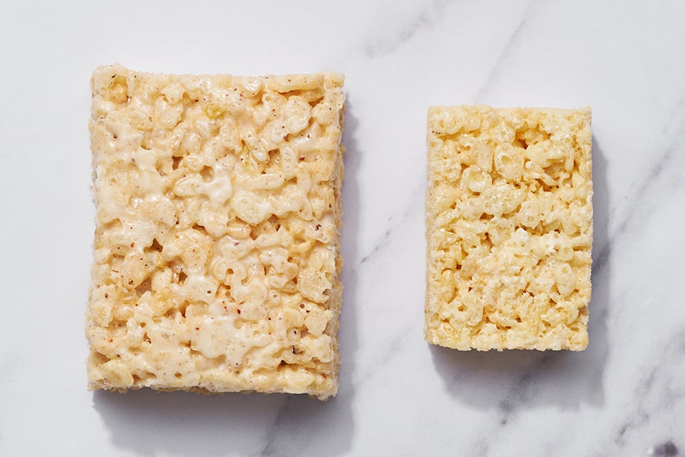 showing the difference in thickness, size and texture of a real store-bought Rice Krispie Treat vs. our homemade Brown Butter Rice Crispy Treats - this time from the top view