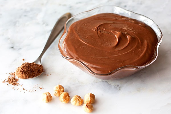 Bowl of creamy homemade Nutella made with hazelnuts and cocoa powder