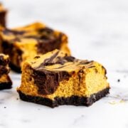 Pumpkin Chocolate Cheesecake Bar with bite taken out
