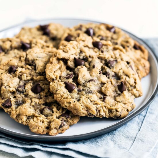 Thick, chewy, and soft, these oatmeal chocolate chip cookies are bursting with ooey gooey chocolate goodness that everyone will love.