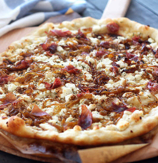 Caramelized Onion, Goat Cheese, Prosciutto Pizza from Handle the Heat