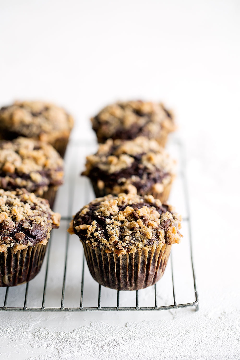 Chocolate Coffee Toffee Crunch Muffins feature a mocha muffin base that's studded with chocolate chips and topped with a crunchy toffee streusel for the best combination of flavor and texture!