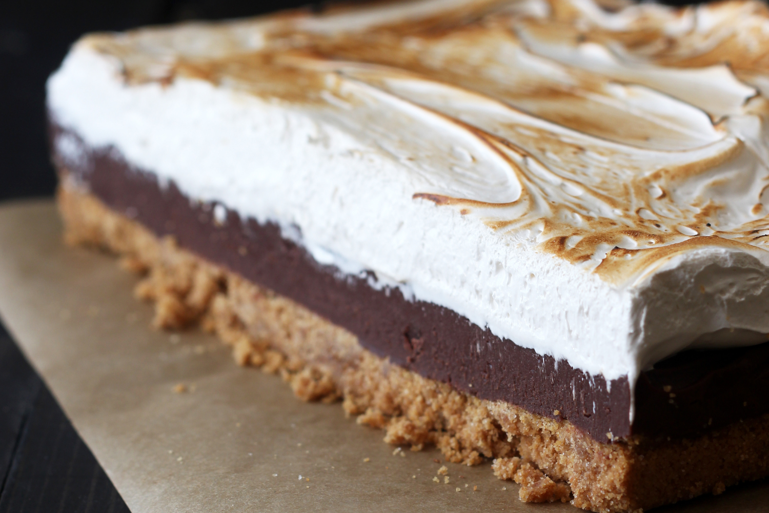 uncut slab of s'mores fudge bars, showing the three delicious distinct layers