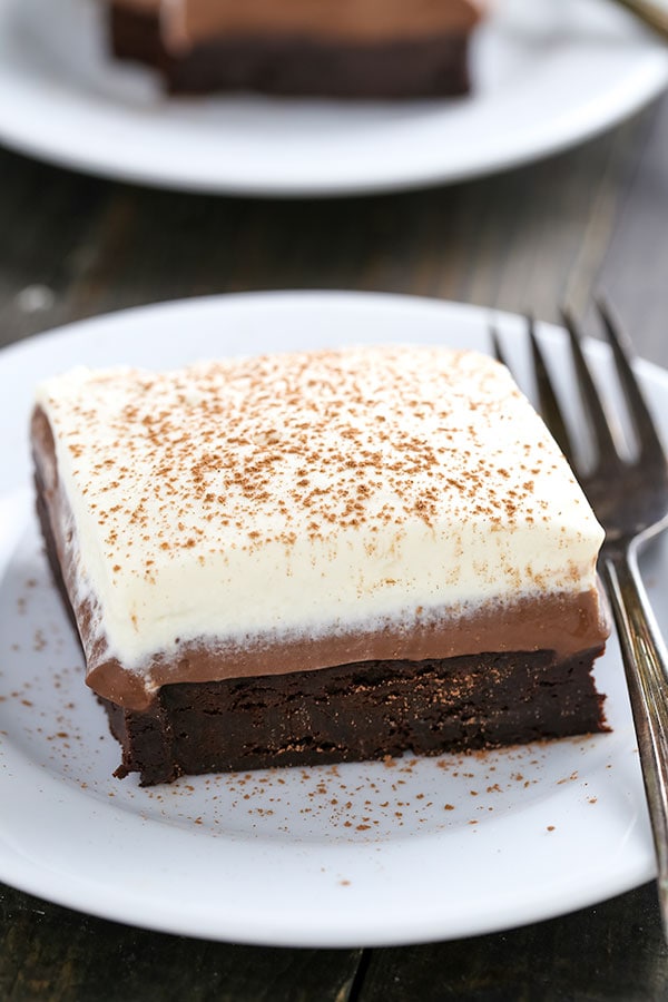 Chocolate Cream Pie Brownies have a rich fudgy brownie bottom, a layer of luscious chocolate cream pie filling, and are topped with homemade whipped cream.