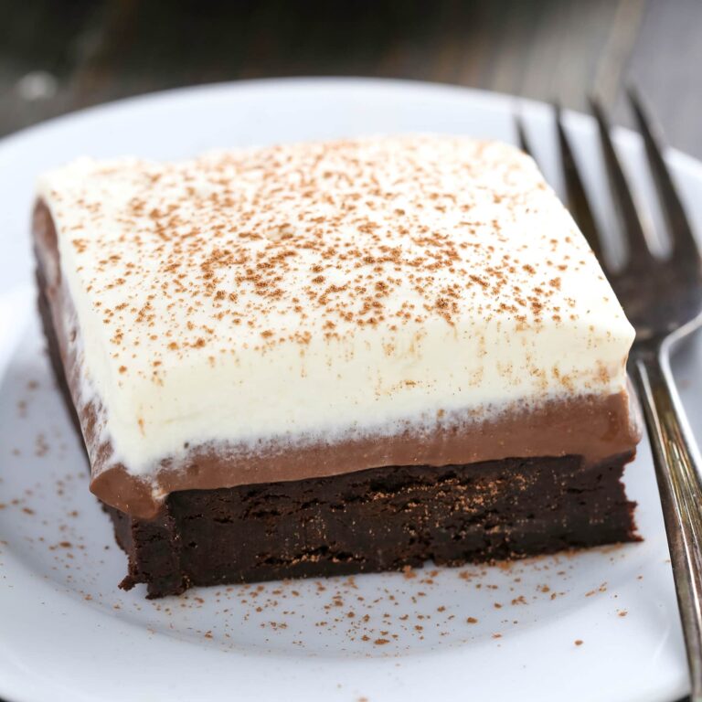 Chocolate Cream Pie Brownies have a rich fudgy brownie bottom, a layer of luscious chocolate cream pie filling, and are topped with homemade whipped cream.