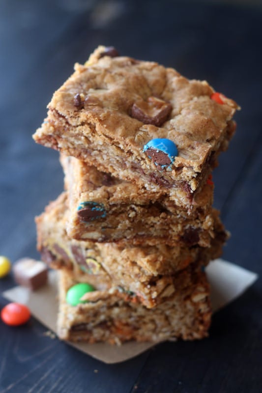 Monster Cookie Bars are filled with oatmeal, peanut butter, chocolate chips, m&ms, and leftover Halloween candy!