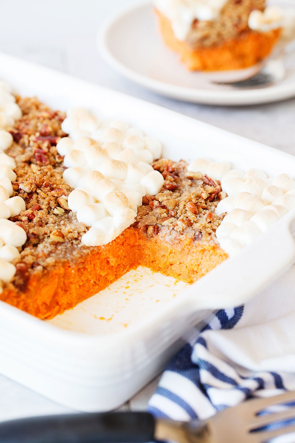 This crowd-pleasing sweet potato casserole has both a pecan topping and a marshmallow topping for the best of both worlds!