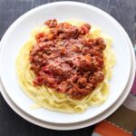 This recipe makes the best bolognese sauce, it's hearty and brimming with savory flavors. Perfect for a cold winter day! Follow the step-by-step photos to see how it's made.
