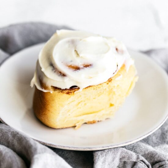 One cinnamon roll on a plate