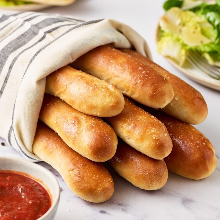 copycat olive garden breadsticks wrapped in a linen cloth.