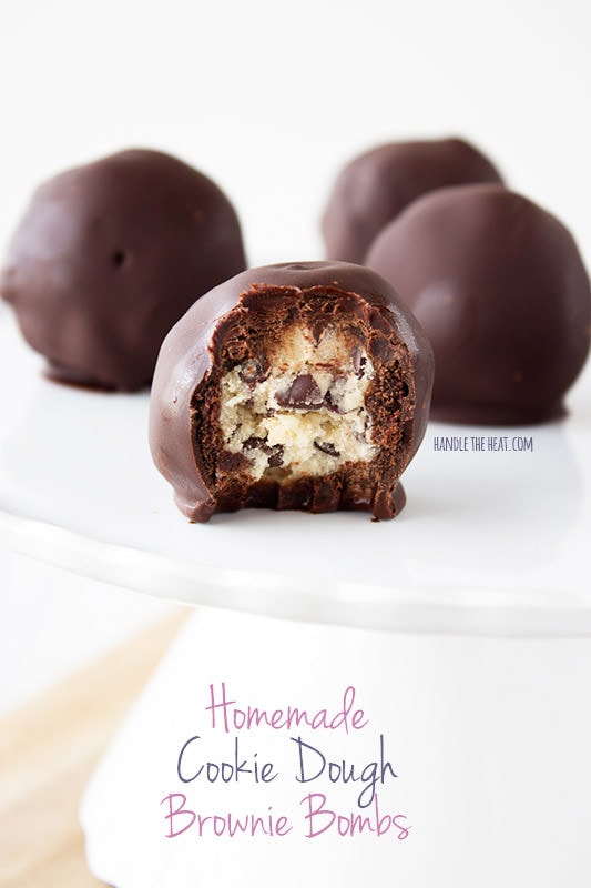 Homemade cookie dough brownie bombs feature egg-free cookie dough balls covered in fudgy homemade brownie and dipped in chocolate. Outrageous!
