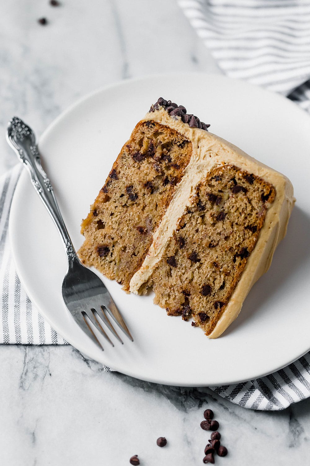 Bursting with sweet flavors, Banana Chocolate Chip Cake with Peanut Butter Frosting is a huge crowd-pleaser and better than any store-bought cake. Love!
