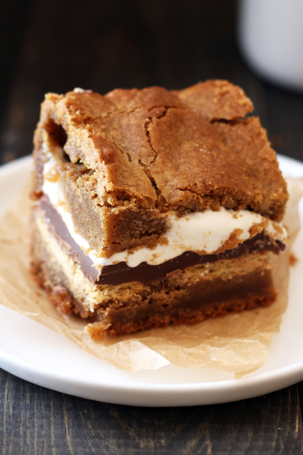 a slice of peanut butter s'mores blondies with distinct layers, ready to serve