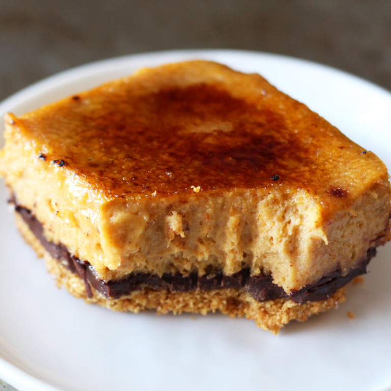 a slice of Crème Brûlée Pumpkin Chocolate Cheesecake on a plate
