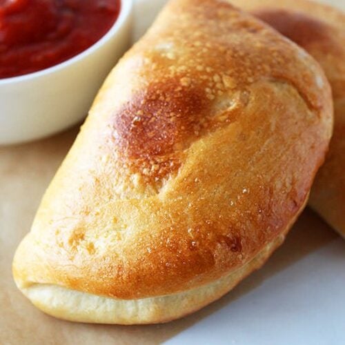 These Mini Calzones are stuffed with meaty cheesy Italian goodness! So crusty.