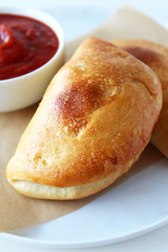 These Mini Calzones are stuffed with meaty cheesy Italian goodness! So crusty.