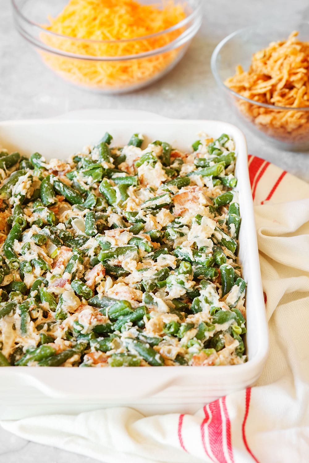 Cheesy Green Bean Casserole with Bacon in a casserole dish 