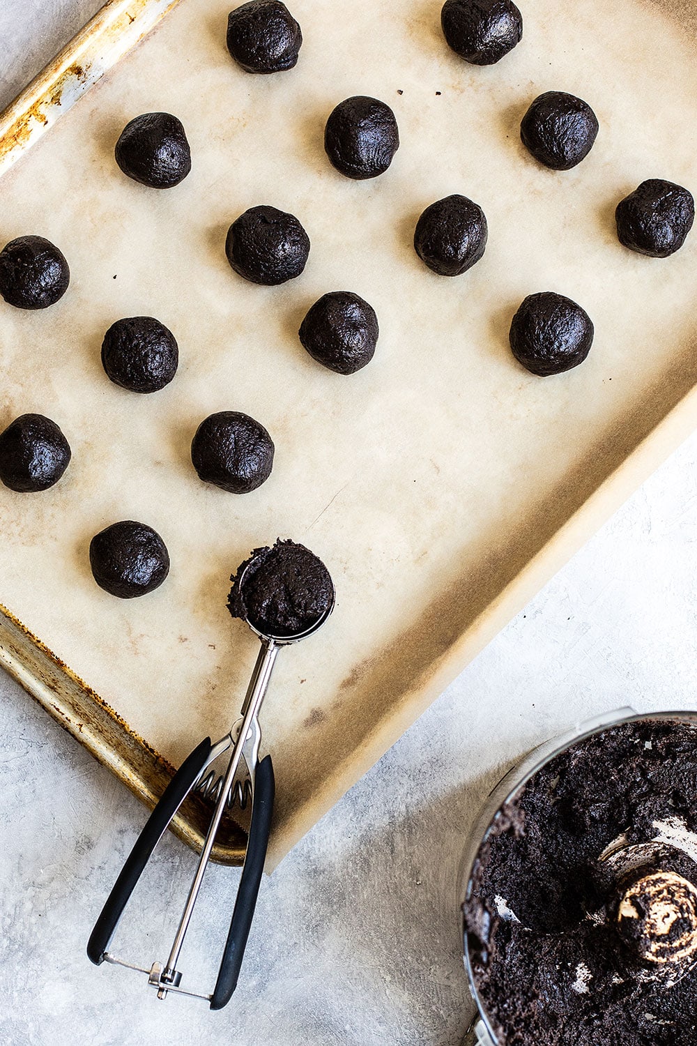 Crushed Oreos being formed into truffles