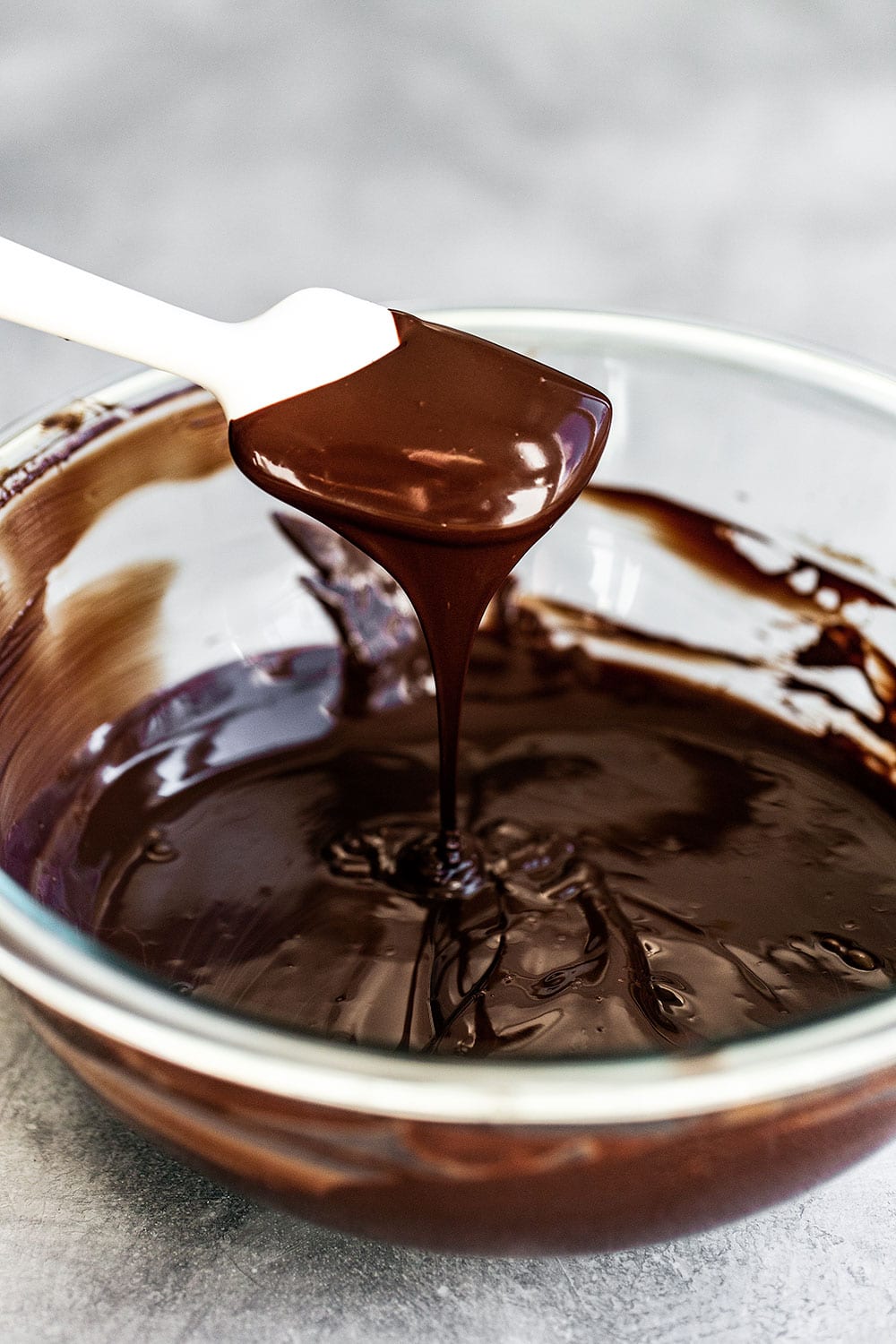 Melted chocolate in a bowl with a spatula
