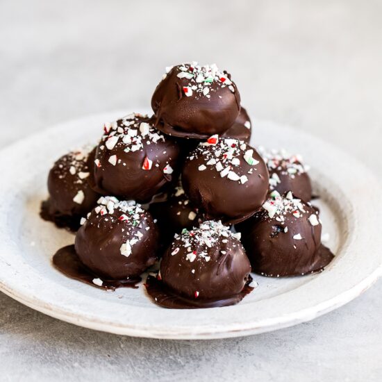 Stack of peppermint oreo truffles on a plate