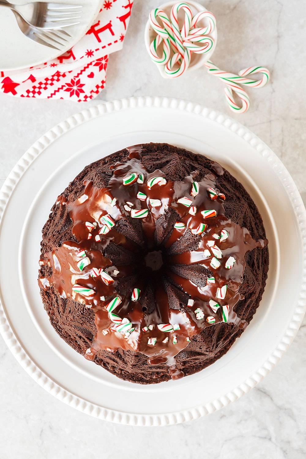 Peppermint Mocha Bundt Cake is the absolute PERFECT holiday cake! It's as easy as it is beautiful and loaded with chocolate, coffee, and peppermint flavors.