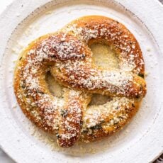 garlic parmesan soft pretzel on a plate