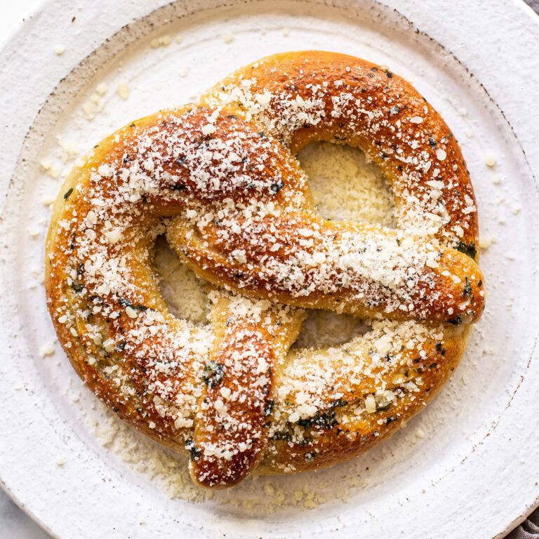 garlic parmesan soft pretzel on a plate