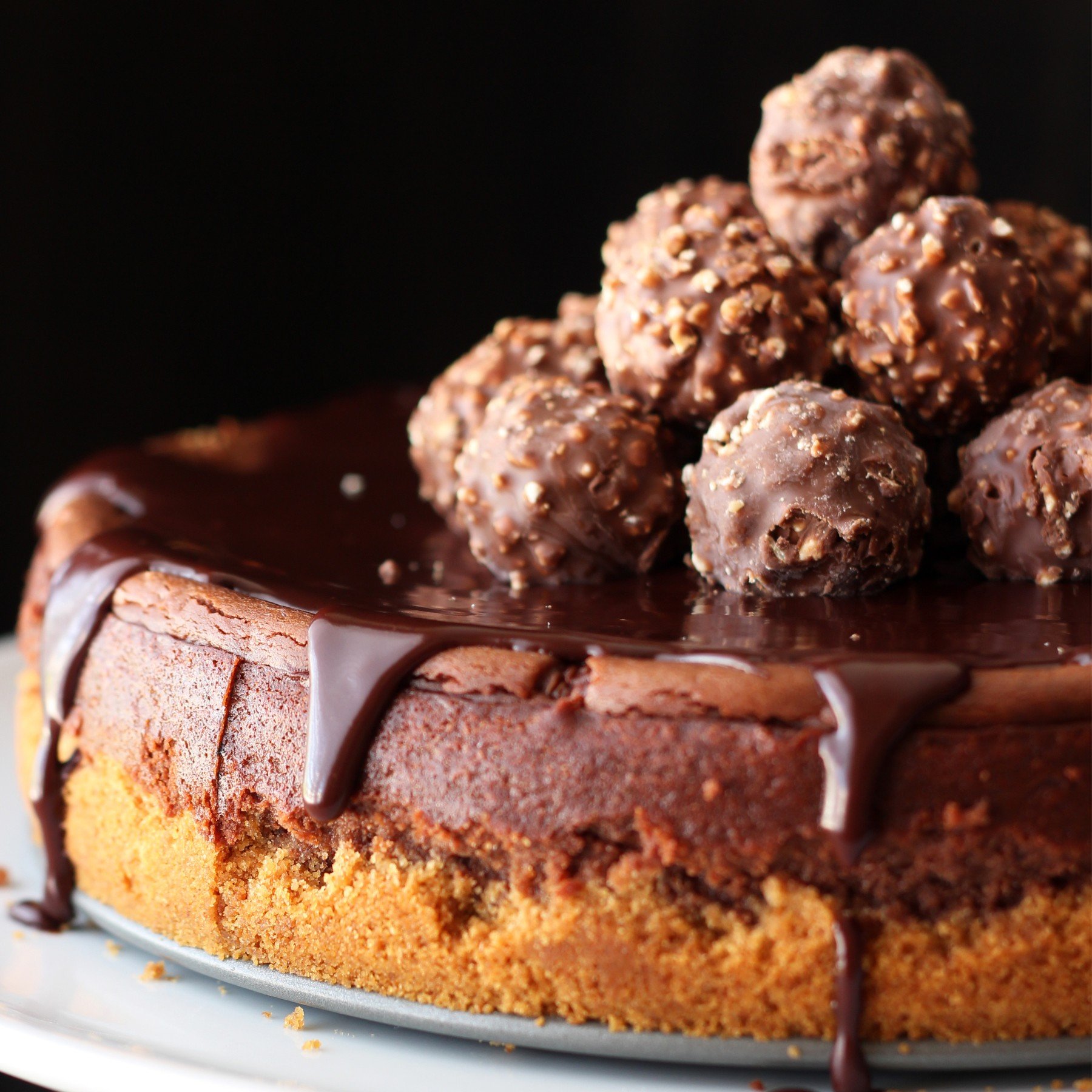 whole unsliced nutella cheesecake, topped with chocolate ganache and finished with a pile of Ferrero Rocher candies.