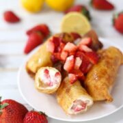 strawberry cheesecake egg rolls with a lemon drizzle