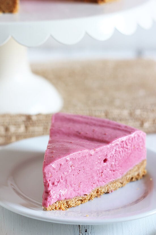 This No Bake Frozen Raspberry Pie is the ultimate fresh and frosty summer recipe perfect for entertaining and lightened up with nonfat yogurt!