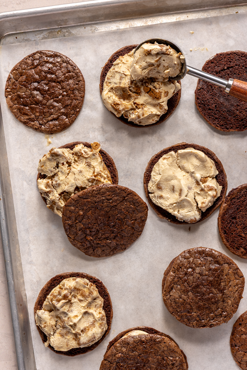 assembling ice cream sandwiches on a tray