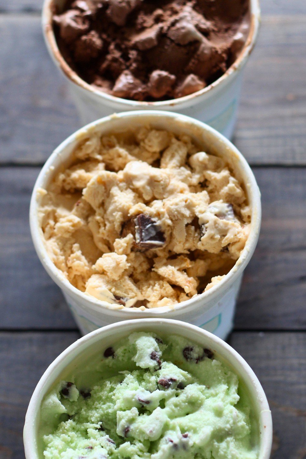 three containers of homemade ice cream - one chocolate, one peanut butter, and one mint chip. Showing you How to Make Ice Cream Without an Ice Cream Machine.