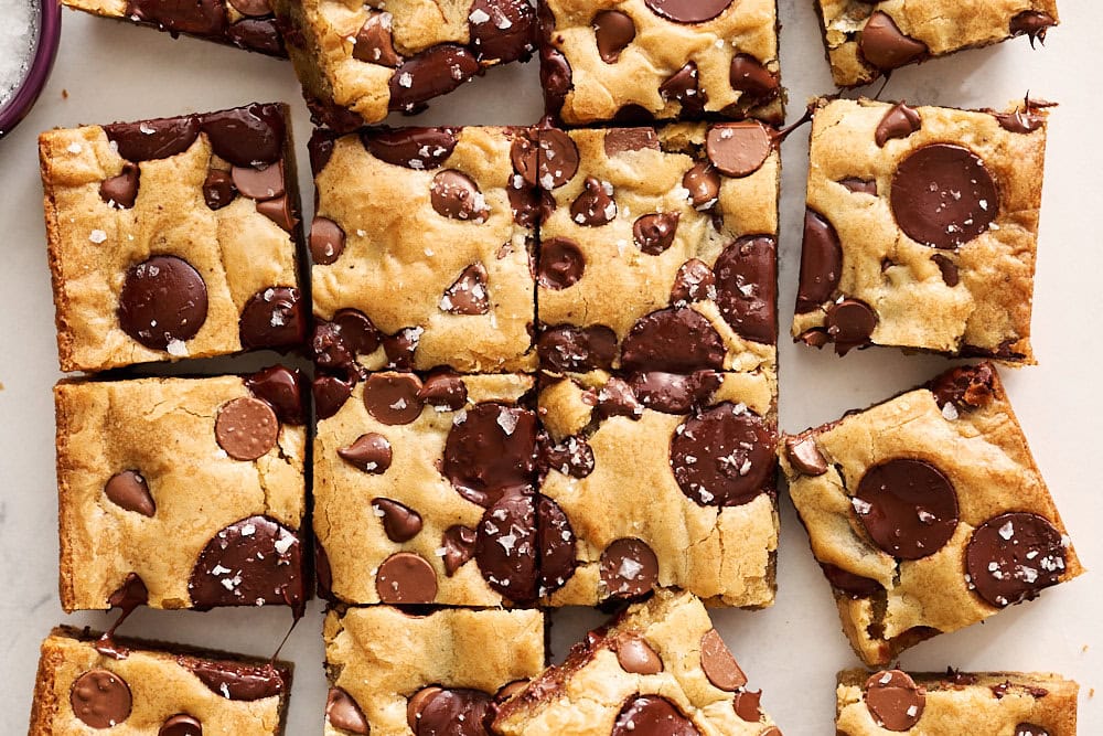 overhead view of browned butter triple chocolate blondies sliced into squares