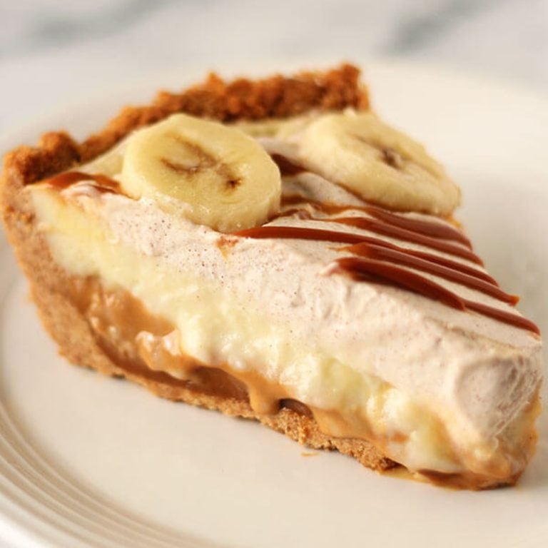 a slice of Banana Dulce de Leche Pie on a white plate.