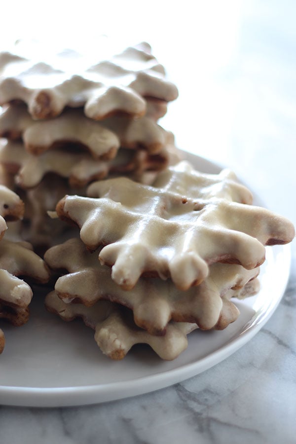 Gingerbread Doughnut Waffles with Maple Glaze are the yummy love child between aromatic gingerbread, sweet doughnuts, and waffles. Breakfast perfection!