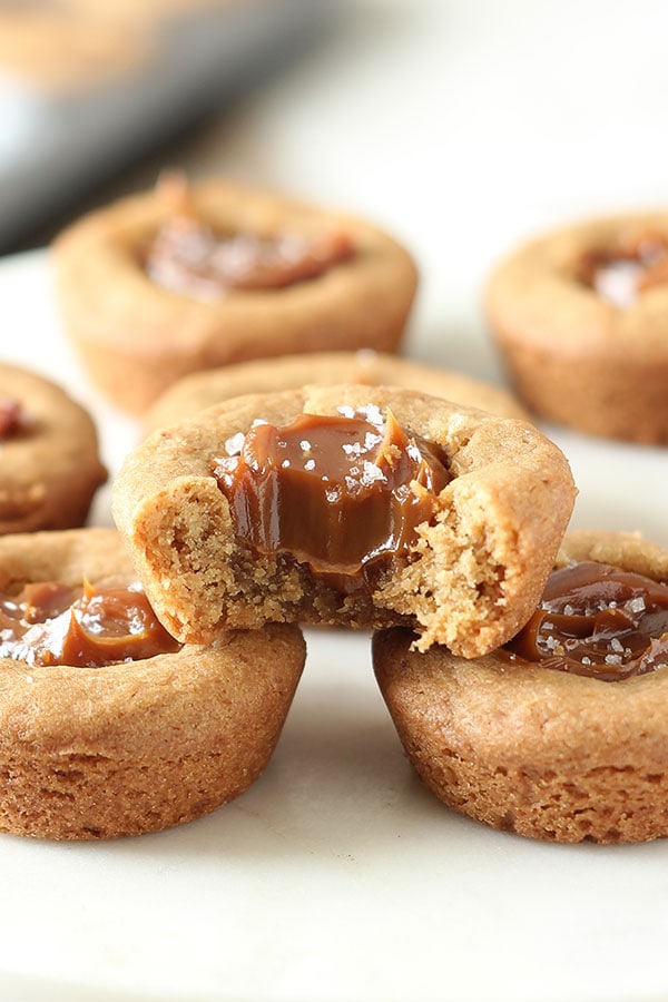 Brown Butter Dulce de Leche Cookie Cups feature an ultra chewy mini cookie cup filled with dulce de leche and sprinkled with sea salt. Pure heaven!