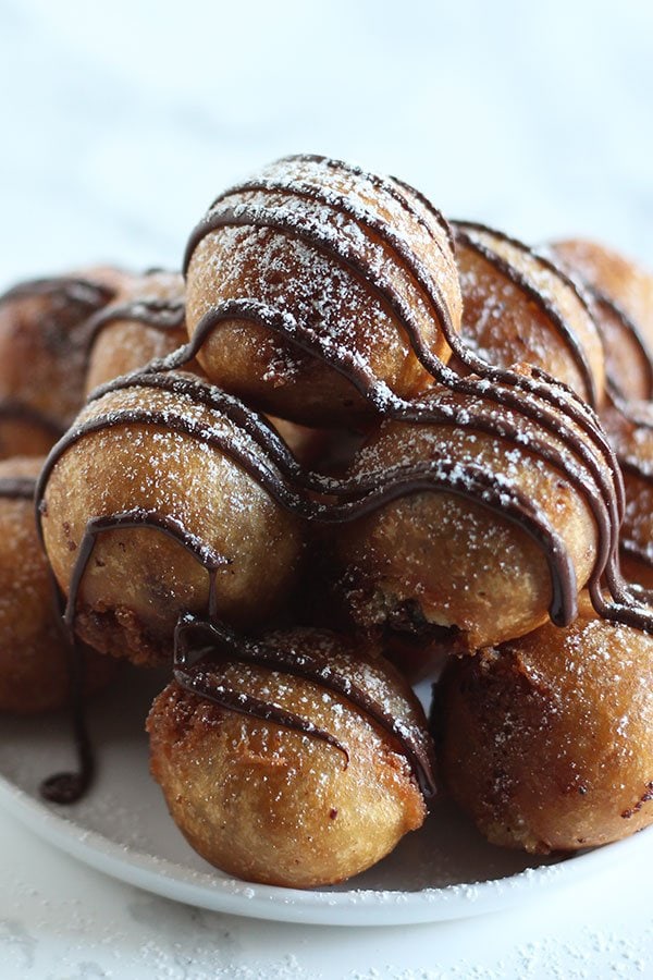 Deep Fried Cookie Dough made with homemade chocolate chip cookie dough, dipped in batter, and fried to golden crispy perfection!