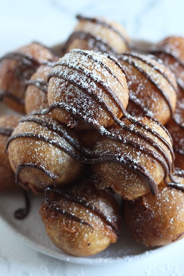 Deep Fried Cookie Dough made with homemade chocolate chip cookie dough, dipped in batter, and fried to golden crispy perfection!