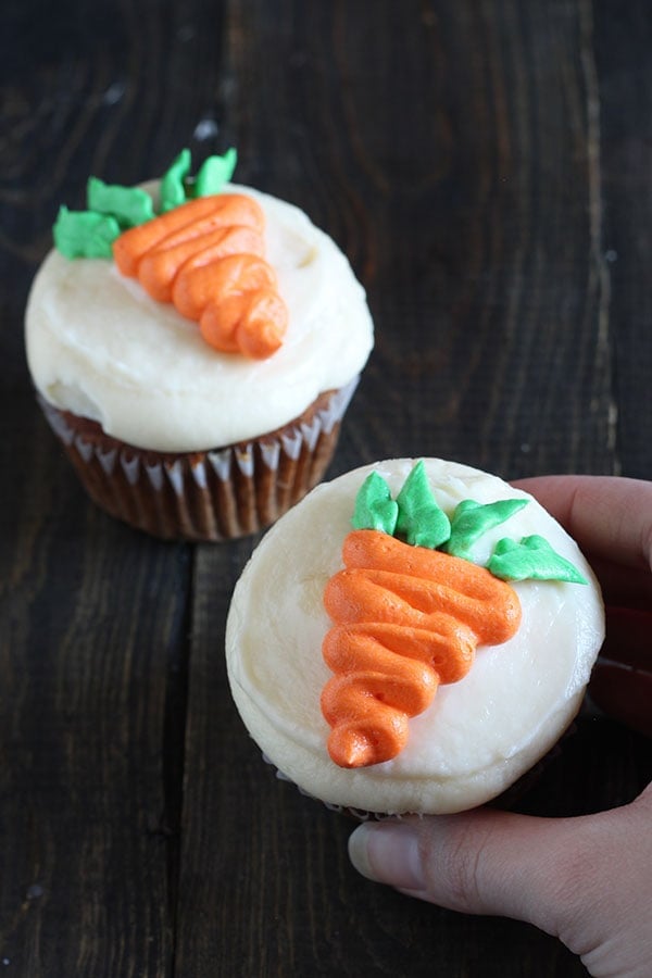 How to Make Decorative Carrots for your carrot cake or cupcakes. Includes a step-by-step video showing THREE ways to make cute carrots: with buttercream, candy melts, and marzipan. Perfect for spring!