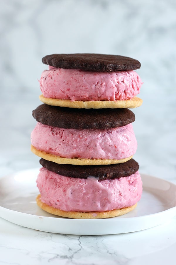 Neapolitan Ice Cream Sandwiches recipe with homemade fresh strawberry ice cream, vanilla wafer cookies, and chocolate wafer cookies sandwiched together.