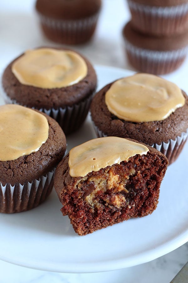 A hidden chocolate chip peanut butter cheesecake filling takes these Peanut Butter Cheesecake Stuffed Chocolate Cupcakes to a whole new level. You'll LOVE this recipe.