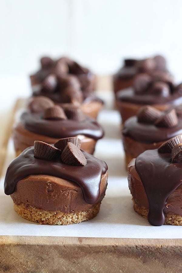 No Bake Mini Peanut Butter Cheesecakes have a crunchy graham cracker crust, ultra rich and creamy chocolate peanut butter cheesecake filling, and are topped with chocolate ganache and mini peanut butter cups. Perfect for when you don't want to turn that oven on!