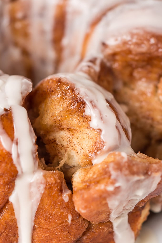 Buttery, cinnamon and sugar coated balls of dough, covered in a sweet creamy glaze... this Monkey Bread is irresistible!